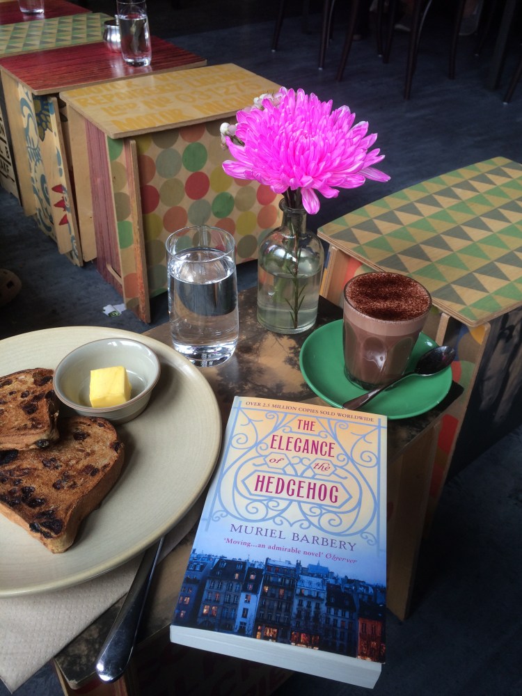 Cafe table with novel and refreshments